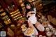 A woman sitting at a table with a tray of food.