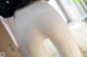 A close up of a woman's butt in white pants.